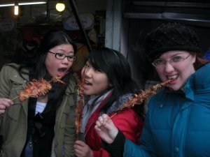 Ting, Pauline and Tanya eat squid at Nanhu market in 2008